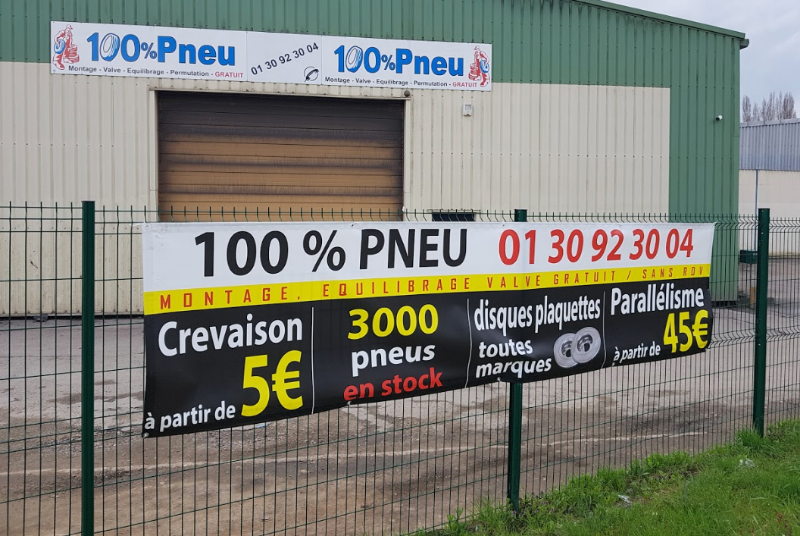 Réalisation du Studio - Bâche publicitaire pour 100% Pneus à Mantes-la-Ville